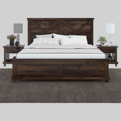 A king size wooden bed with a dark walnut finish, featuring a headboard and footboard, with bedding and pillows on it.