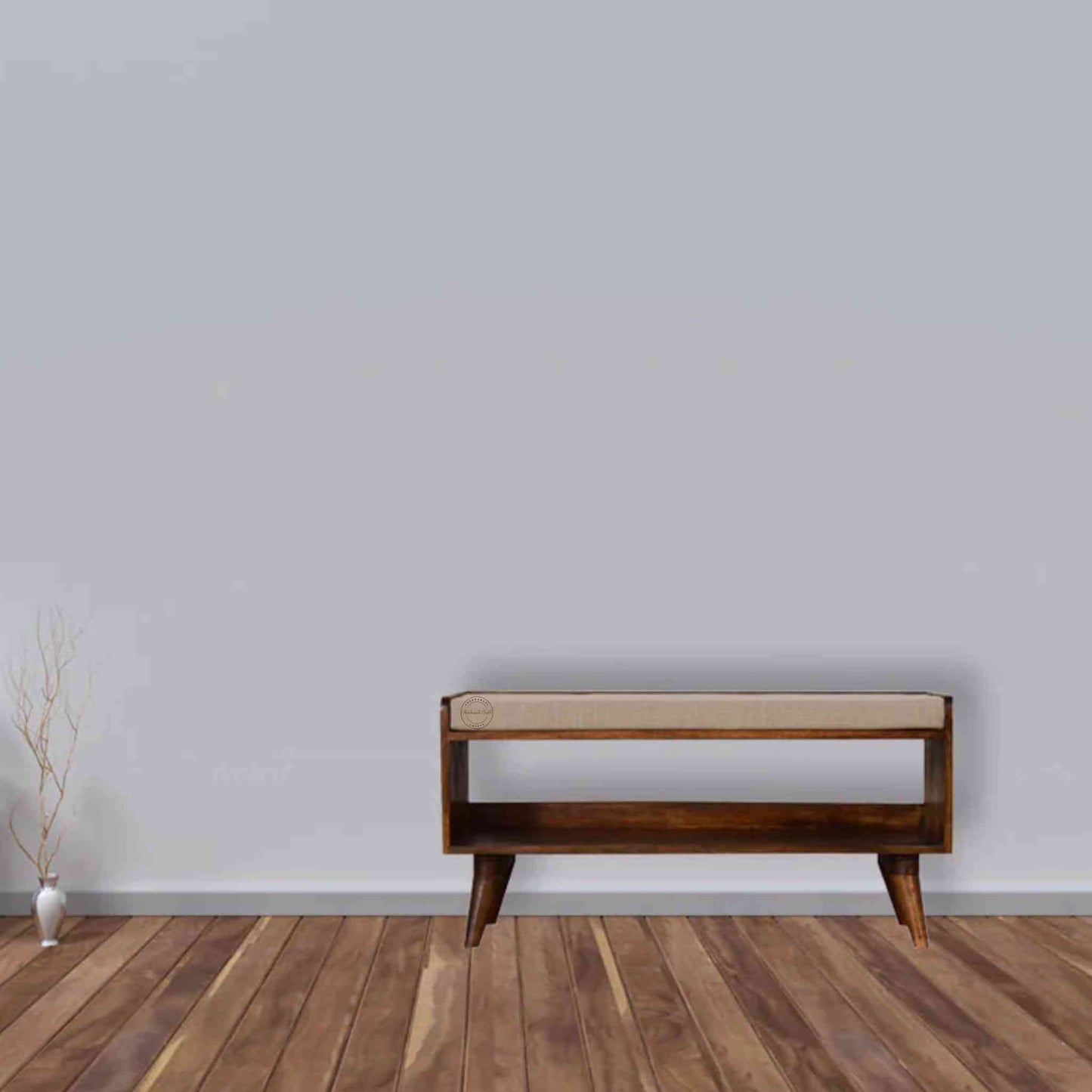 Lammi Bench is handcrafted with sheesham wood, cushion, honey finish, detachable legs and a storage shelf.