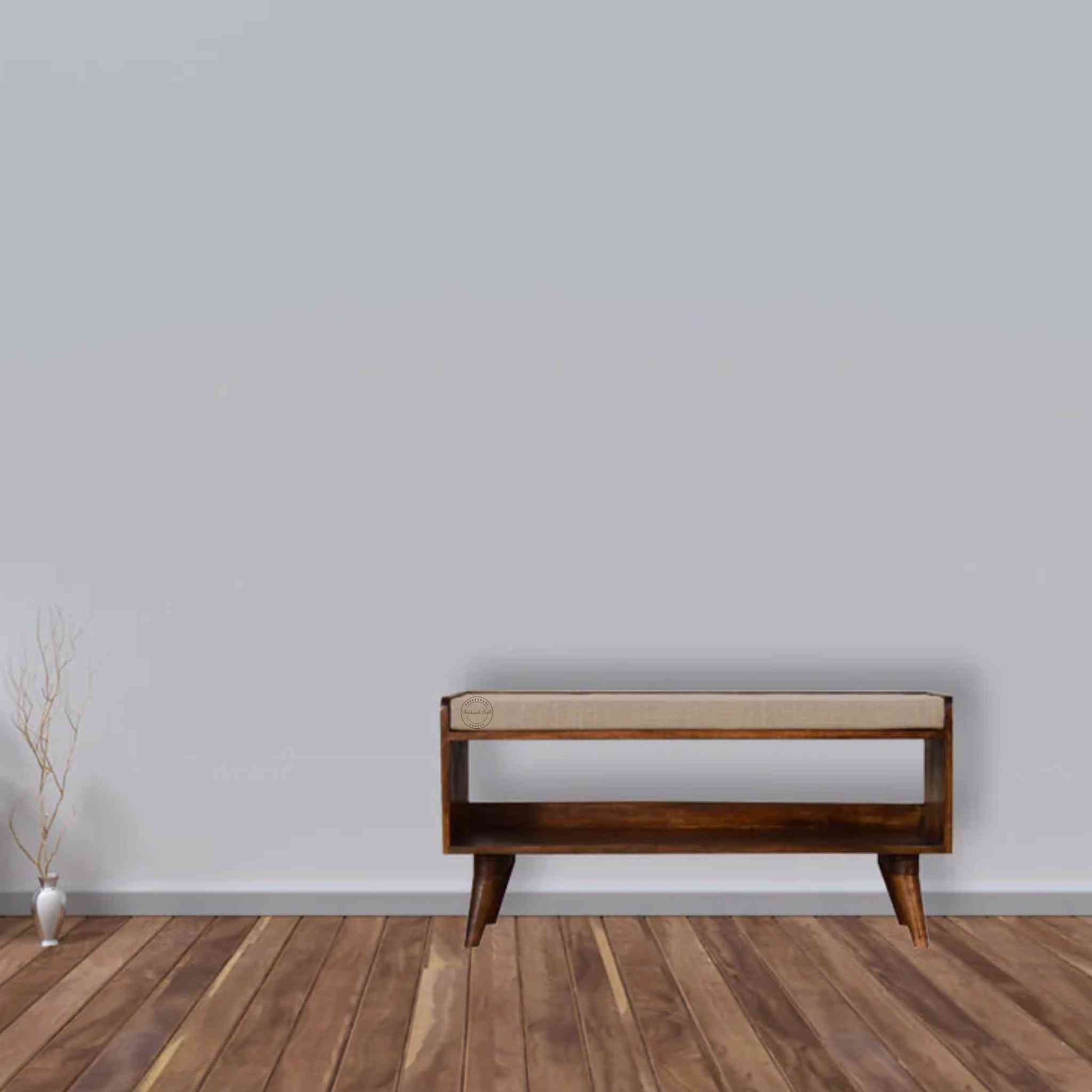 Lammi Bench is handcrafted with sheesham wood, cushion, honey finish, detachable legs and a storage shelf.