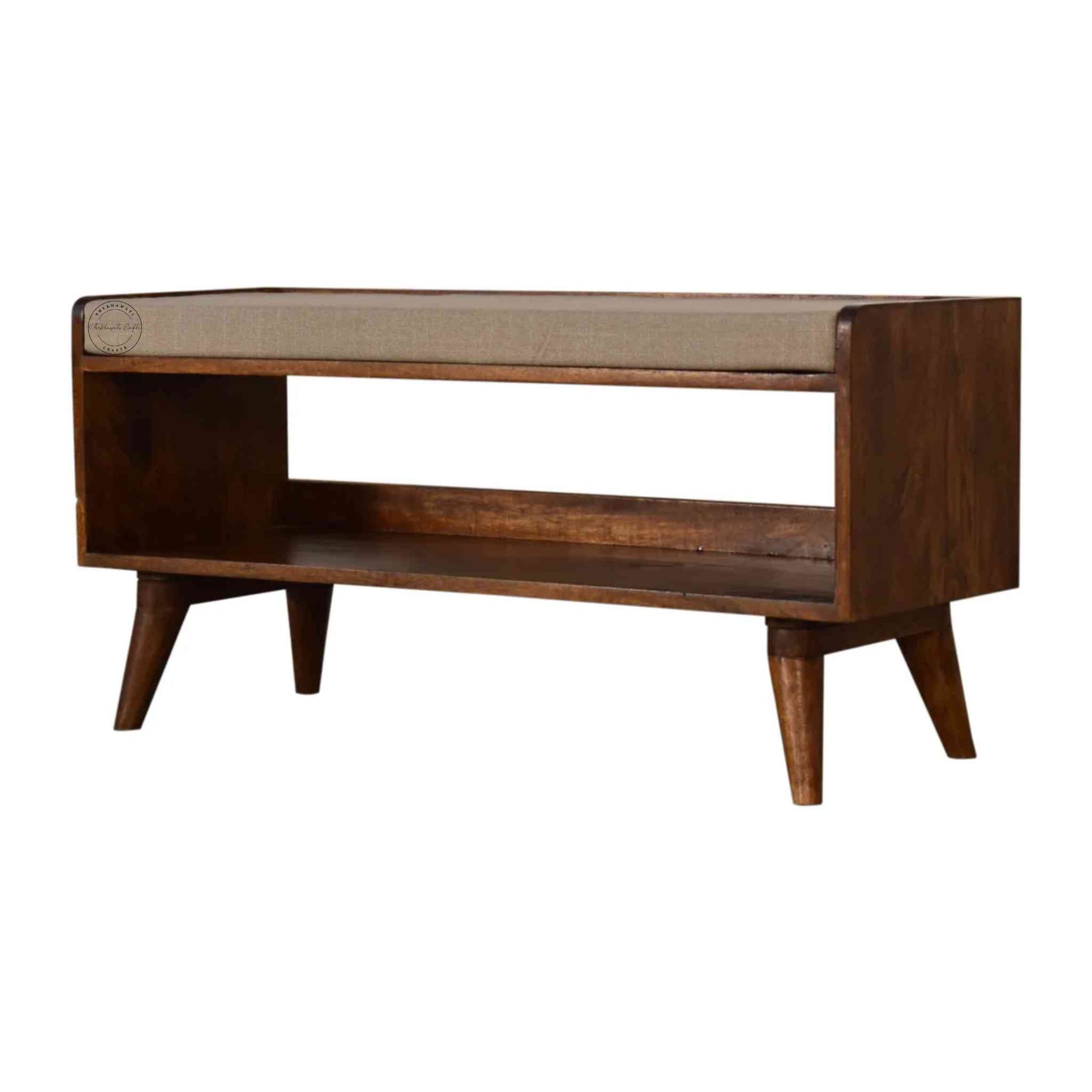 Lammi Bench is handcrafted with sheesham wood, cushion, honey finish, detachable legs and a storage shelf.