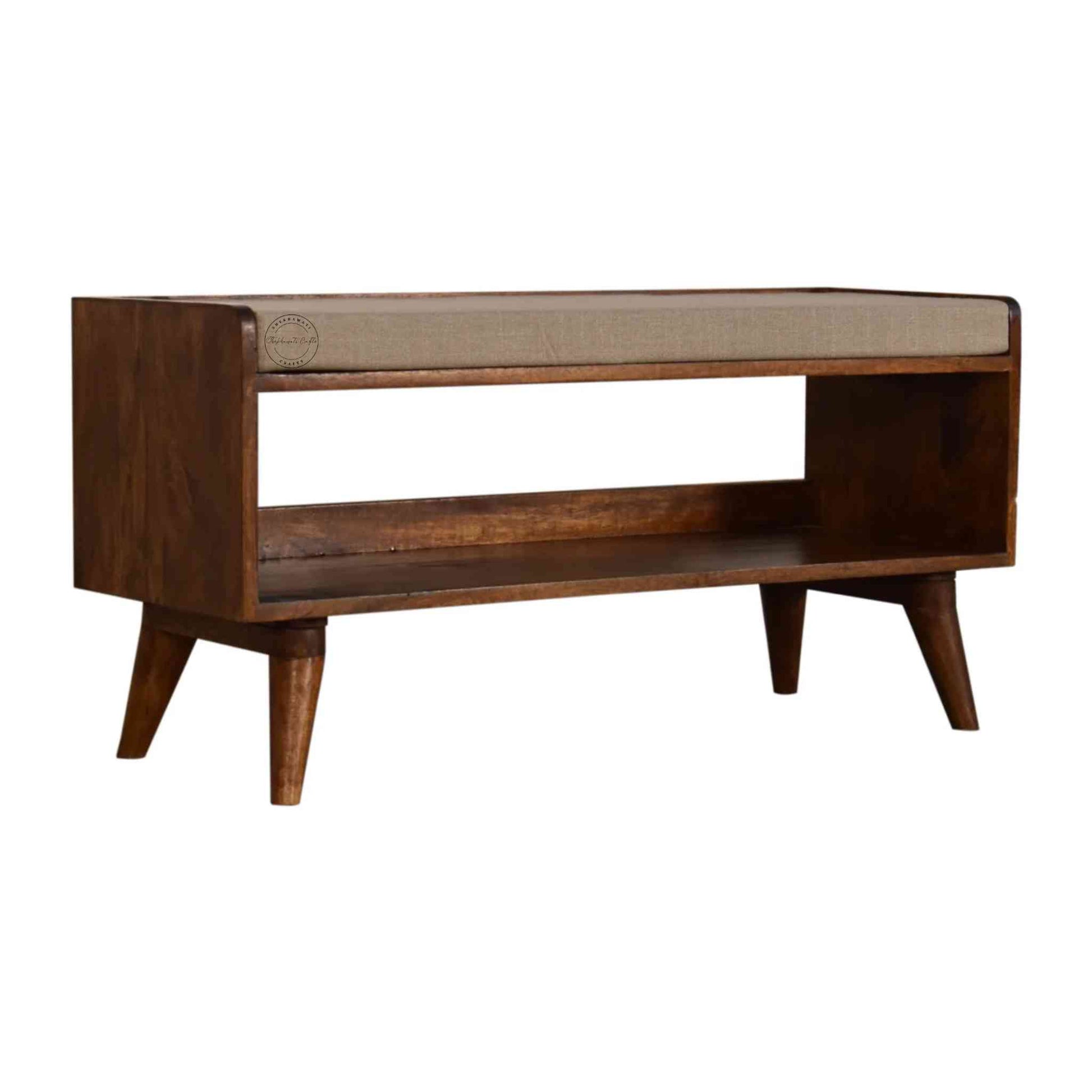 Lammi Bench is handcrafted with sheesham wood, cushion, honey finish, detachable legs and a storage shelf.