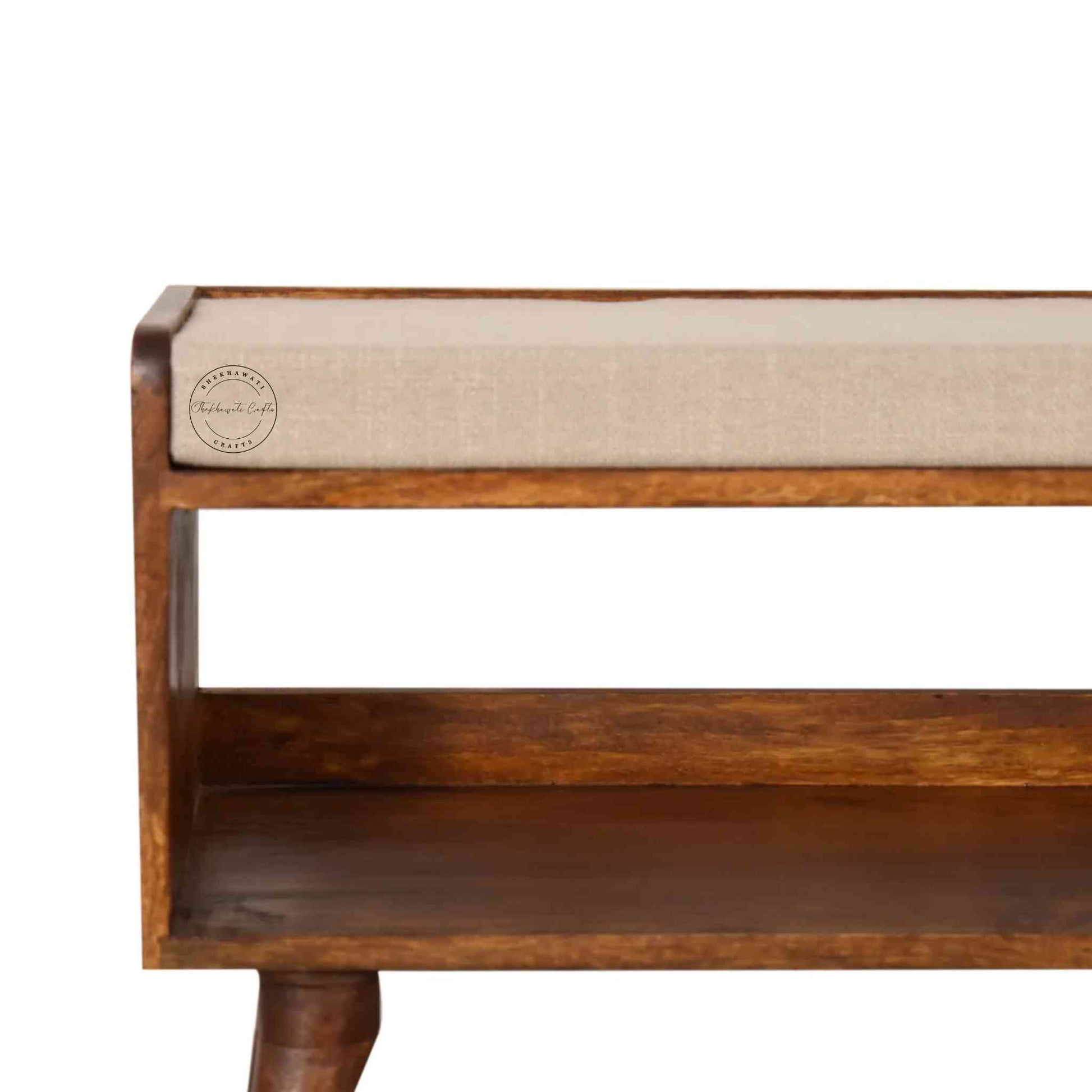 Lammi Bench is handcrafted with sheesham wood, cushion, honey finish, detachable legs and a storage shelf.