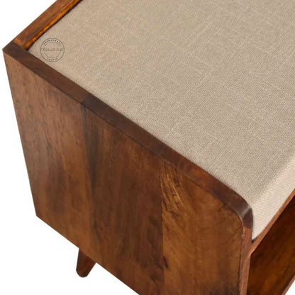 Lammi Bench is handcrafted with sheesham wood, cushion, honey finish, detachable legs and a storage shelf.