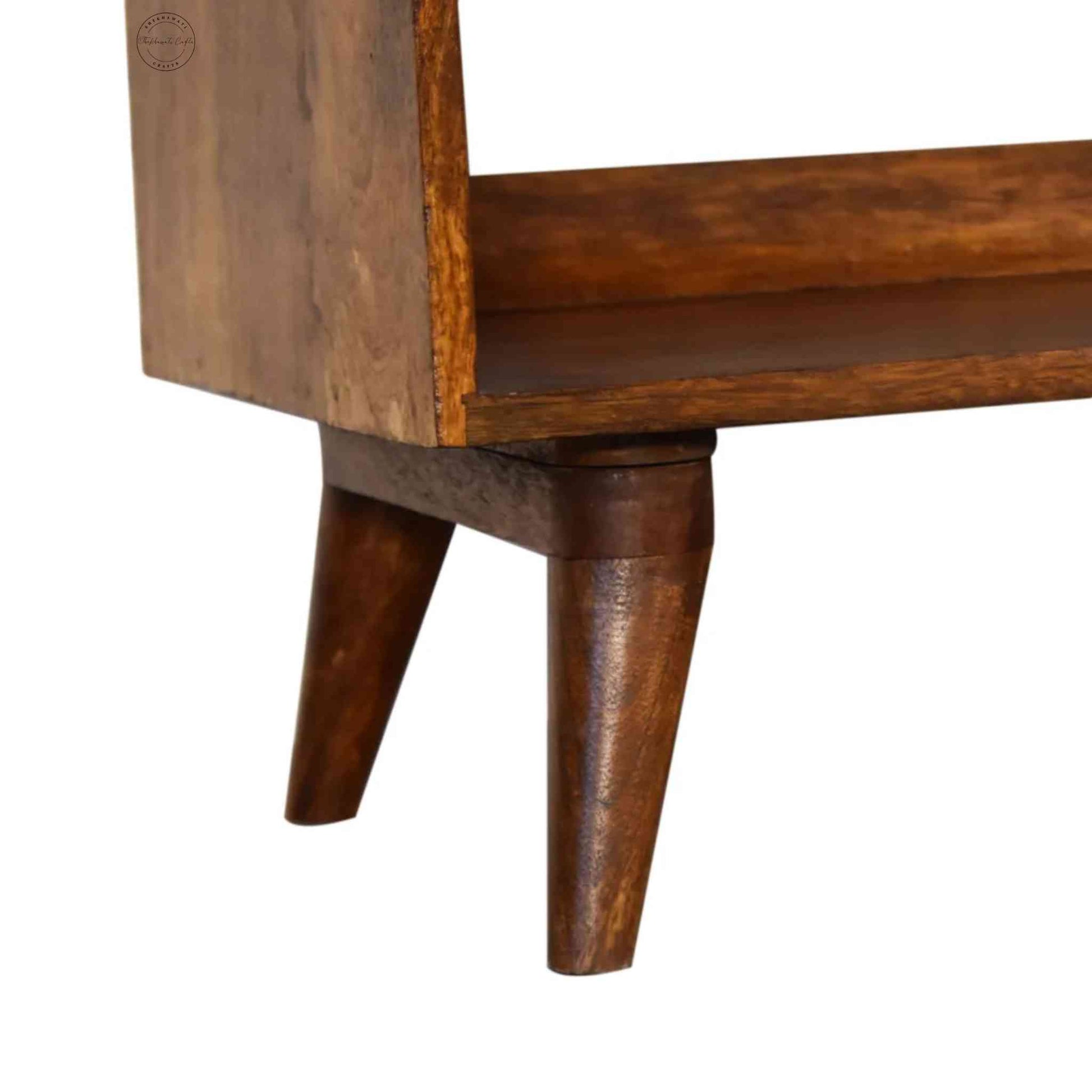 Lammi Bench is handcrafted with sheesham wood, cushion, honey finish, detachable legs and a storage shelf.