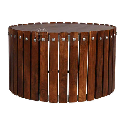 Handcrafted from Sheesham wood, the Leore Coffee Table features a round shape design and warm honey finish.