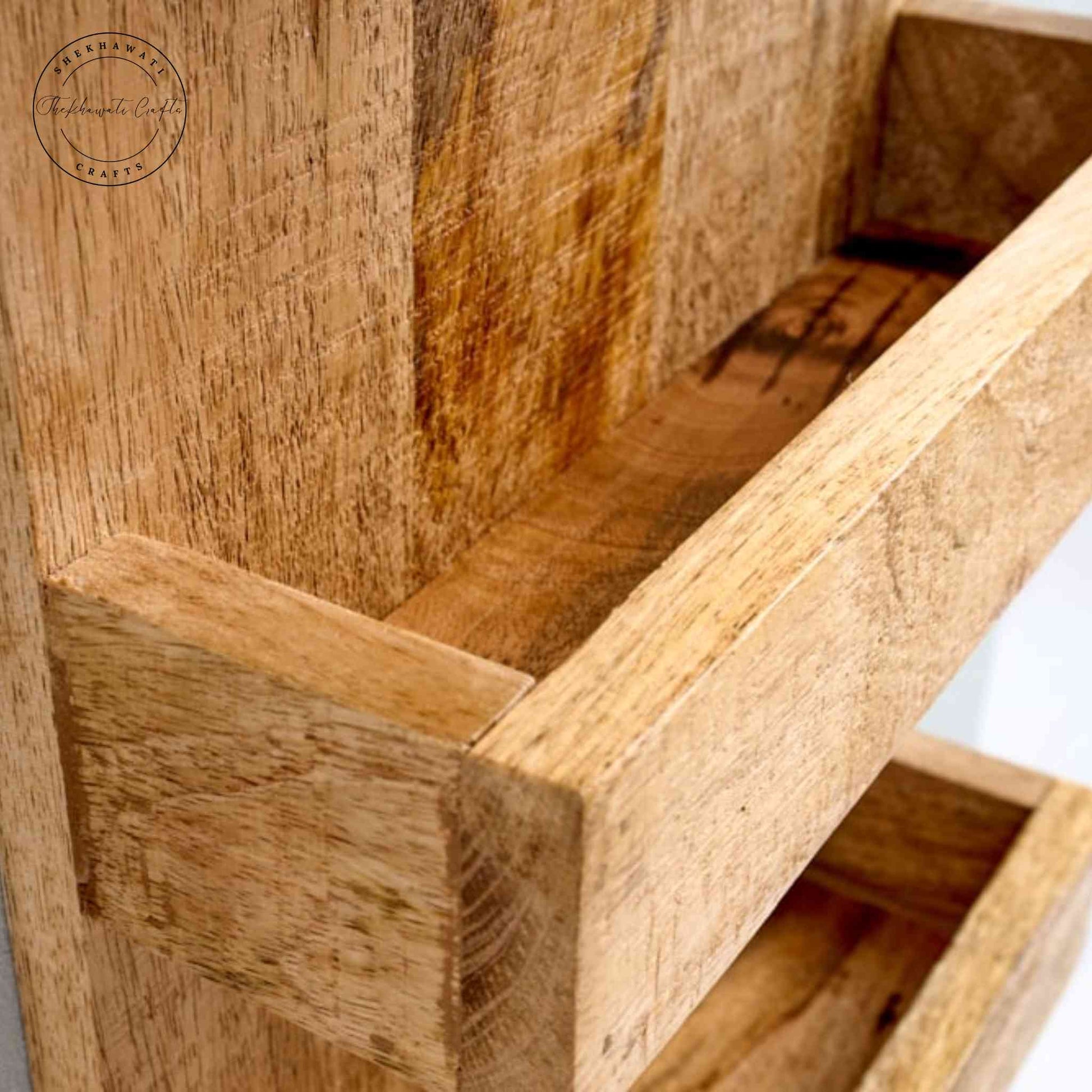Levon Solid Wood Wall Hanging Shelf handcrafted from mango wood with four tiers and a natural finish — perfect for displaying decor, books, and accessories.