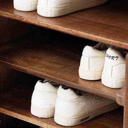 Lirra Shoe Rack, modern mango wood shoe rack cabinet with a honey finish, 2 drawers, 3 detachable shelves, and 2 doors.