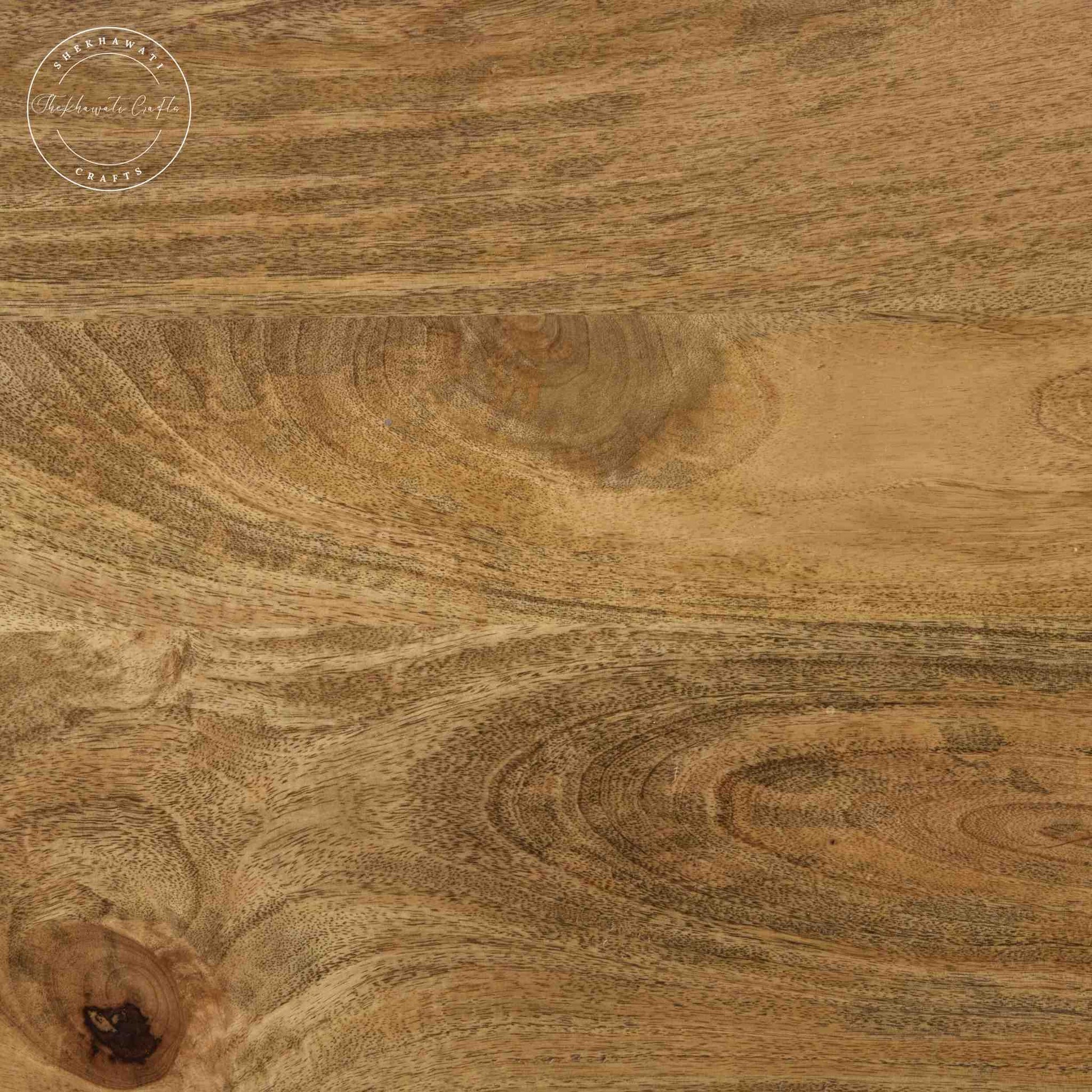 Maron wooden dining table is crafted with mango wood with a natural finish and round shape legs.