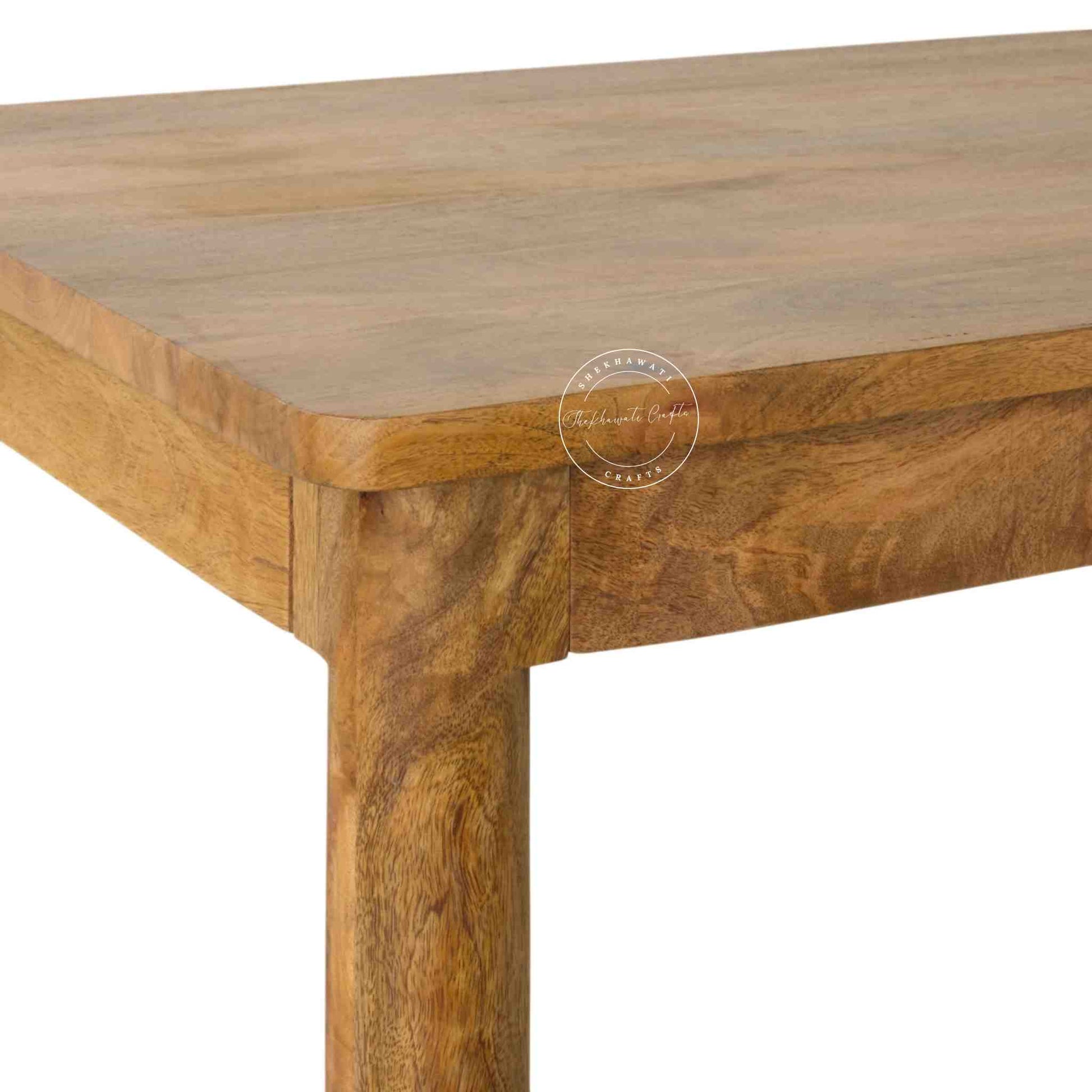 Maron wooden dining table is crafted with mango wood with a natural finish and round shape legs.