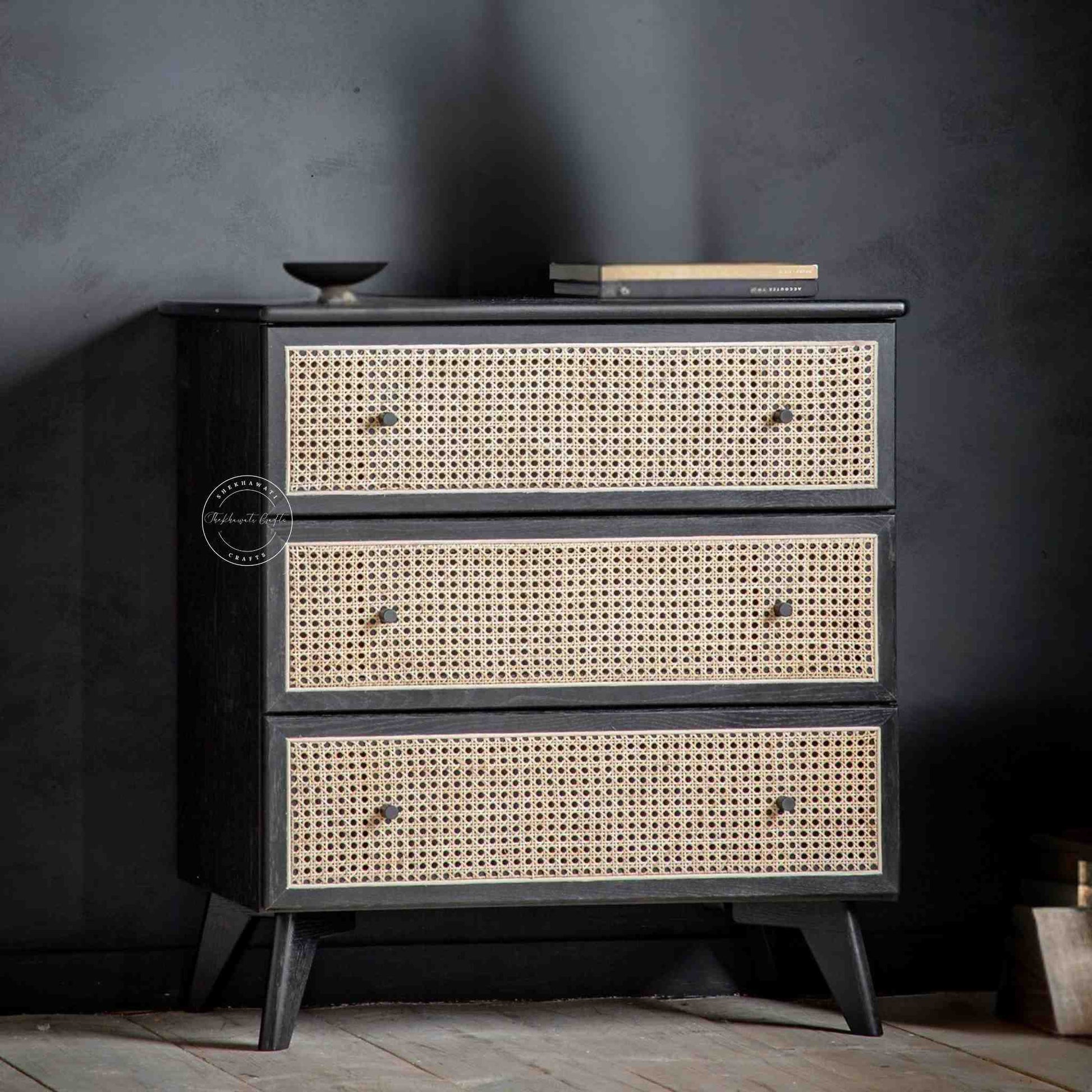 Murphy rattan chest of drawers crafted from solid mango wood with a rattan cane design, featuring a matte black finish and 3 drawers.