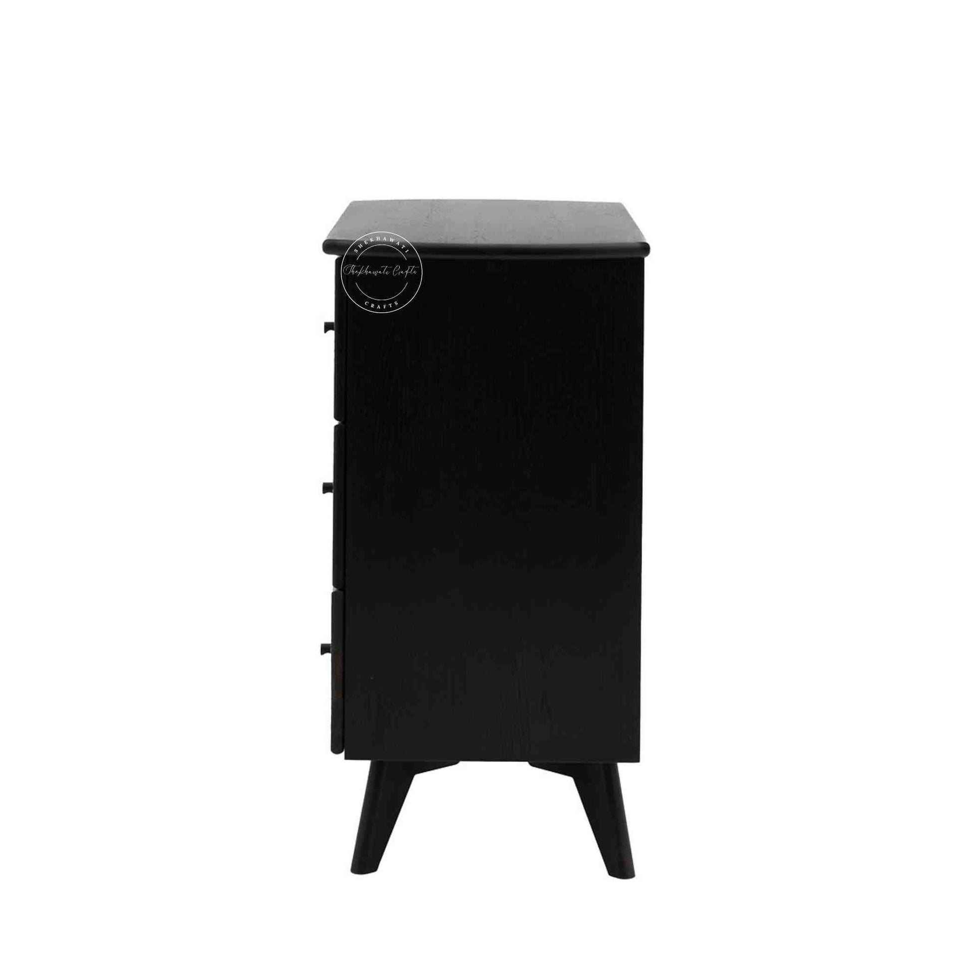 Murphy rattan chest of drawers crafted from solid mango wood with a rattan cane design, featuring a matte black finish and 3 drawers.