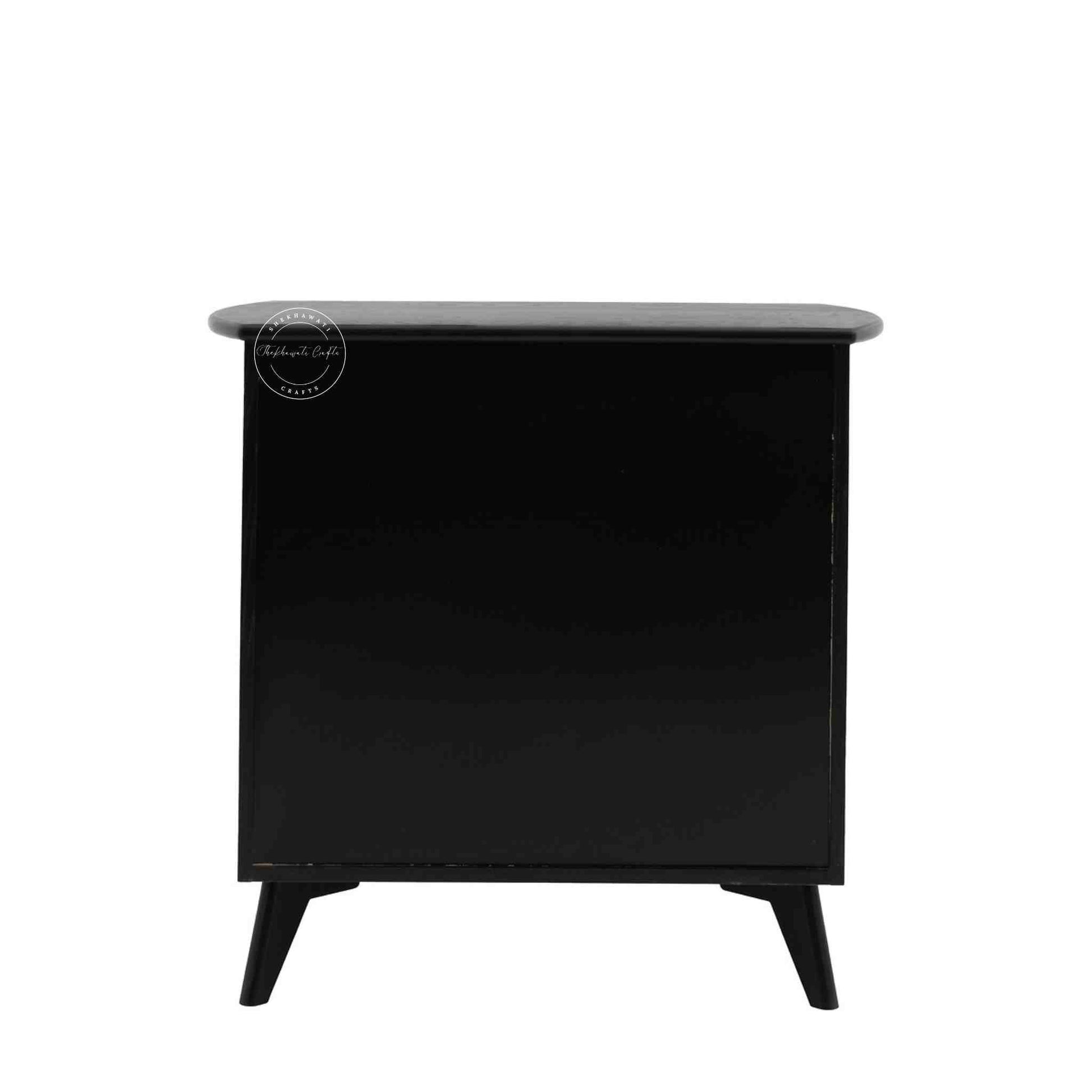 Murphy rattan chest of drawers crafted from solid mango wood with a rattan cane design, featuring a matte black finish and 3 drawers.
