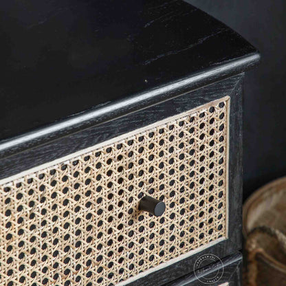 Murphy rattan chest of drawers crafted from solid mango wood with a rattan cane design, featuring a matte black finish and 3 drawers.