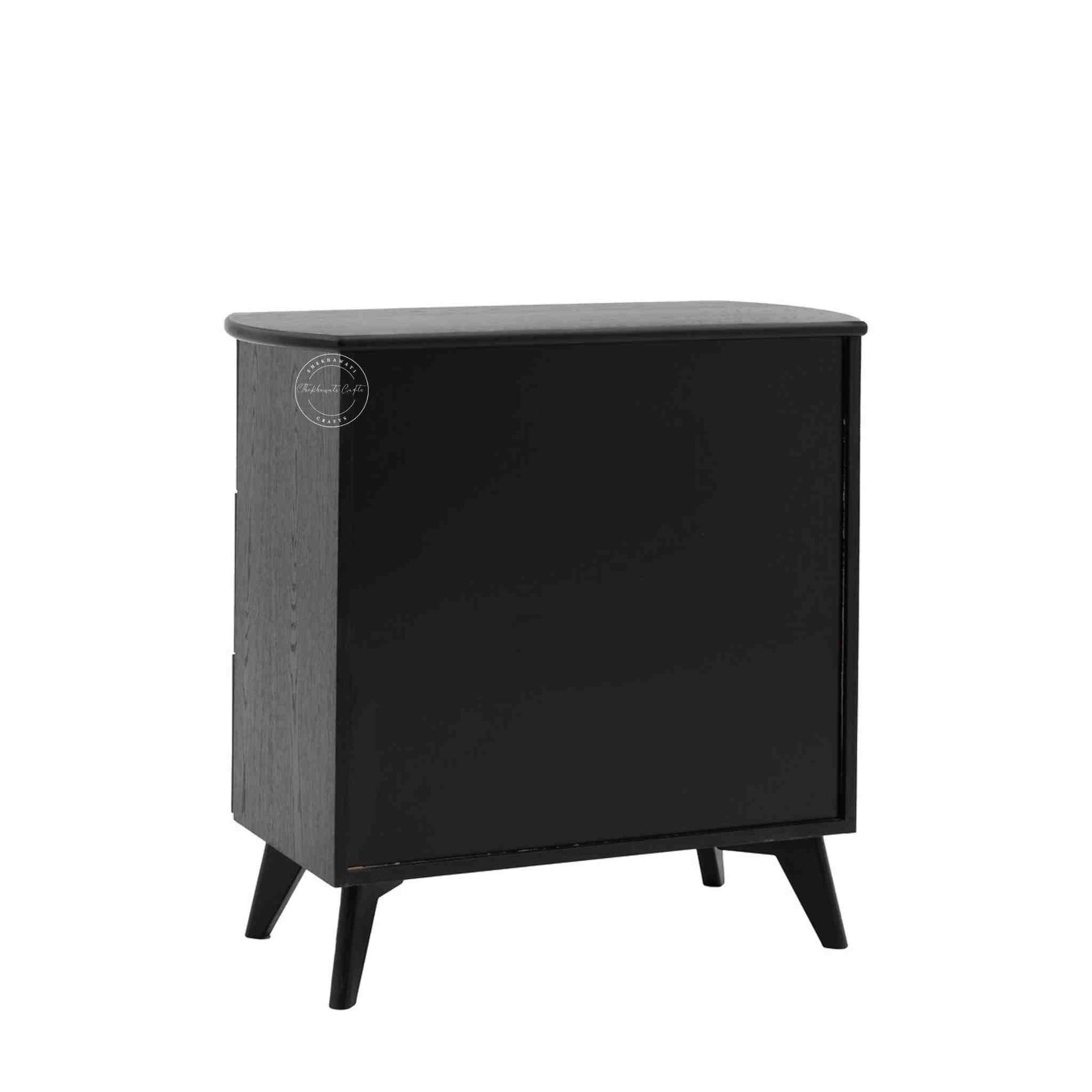 Murphy rattan chest of drawers crafted from solid mango wood with a rattan cane design, featuring a matte black finish and 3 drawers.