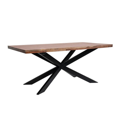 A rectangular dining table with wooden top in a warm brown tone and a black metal X-shaped base, shown on a plain white background.
