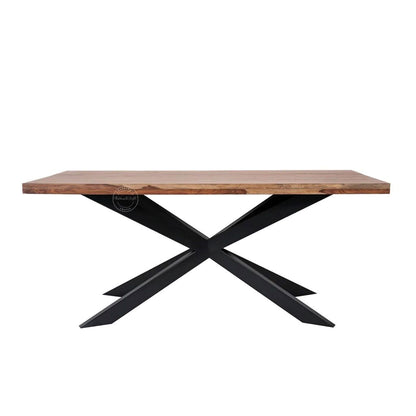 A rectangular dining table with a natural wood top and a black metal X-shaped base, shown against a plain white background.