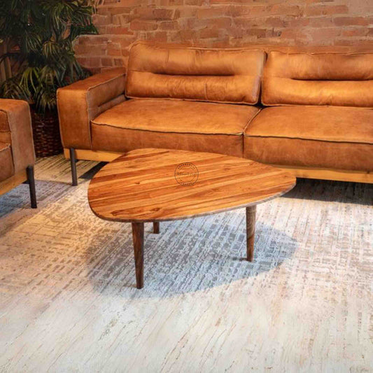 Nitara Coffee Table is crafted from sheesham wood with detachable wood legs and a natural finish.