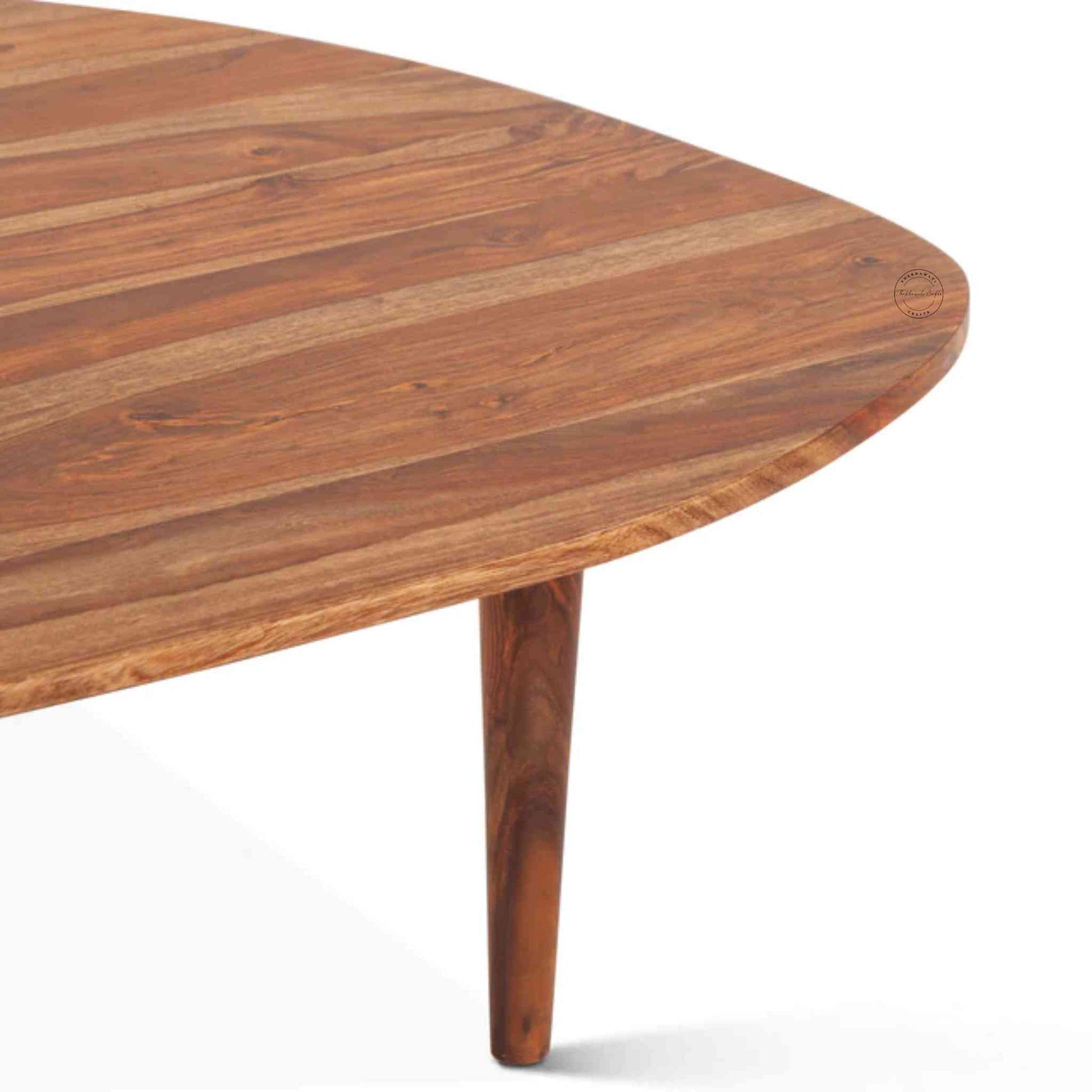 Nitara Coffee Table is crafted from sheesham wood with detachable wood legs and a natural finish.