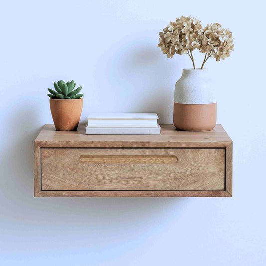 Nivara wall shelve is handcrafted from mango wood with a natural finish.