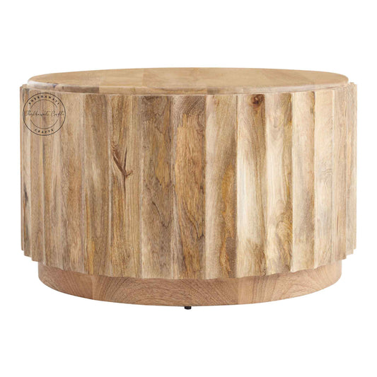 Ossa Coffee Table is handcrafted from mango wood with a round curved design and natural finish.