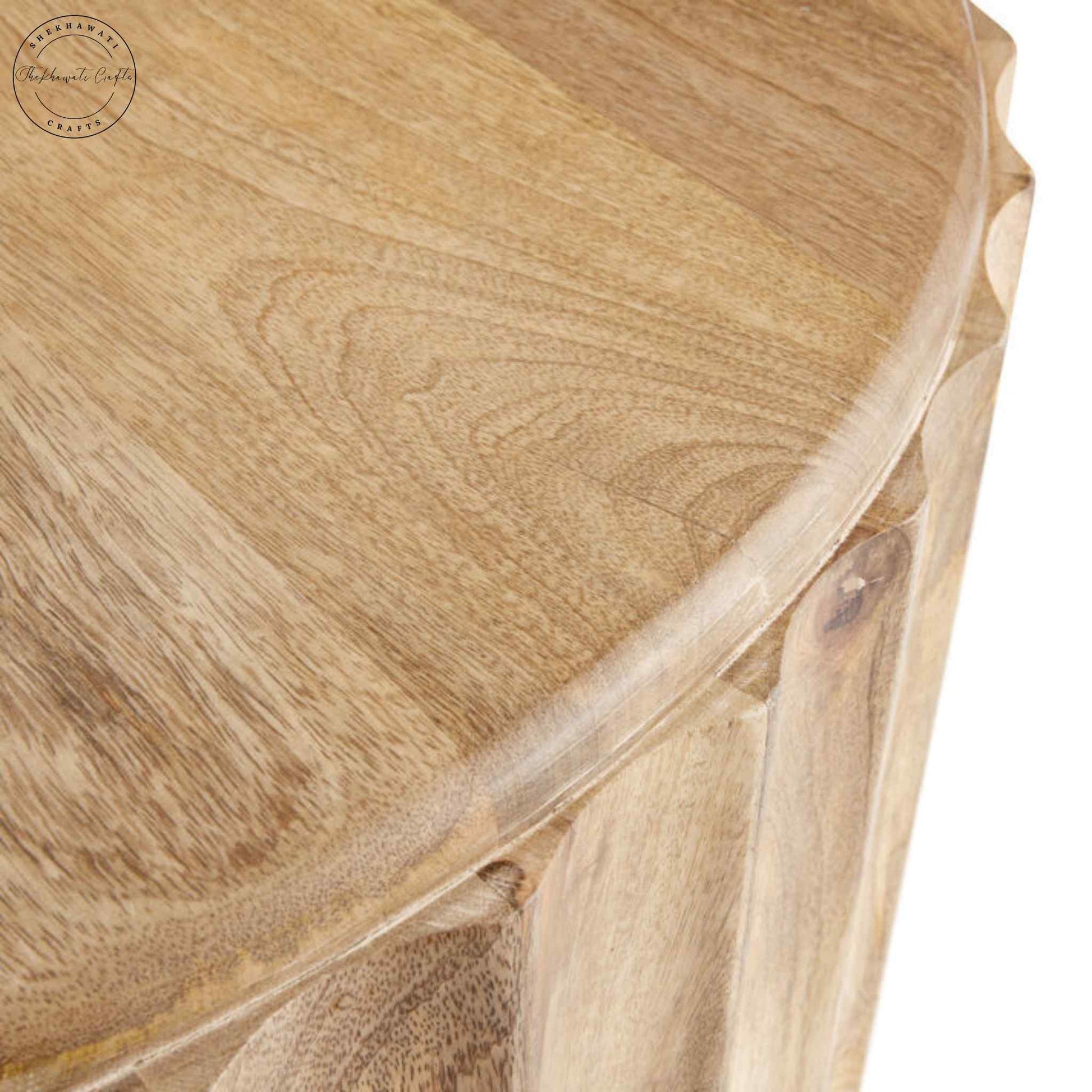 Ossa Coffee Table is handcrafted from mango wood with a round curved design and natural finish.