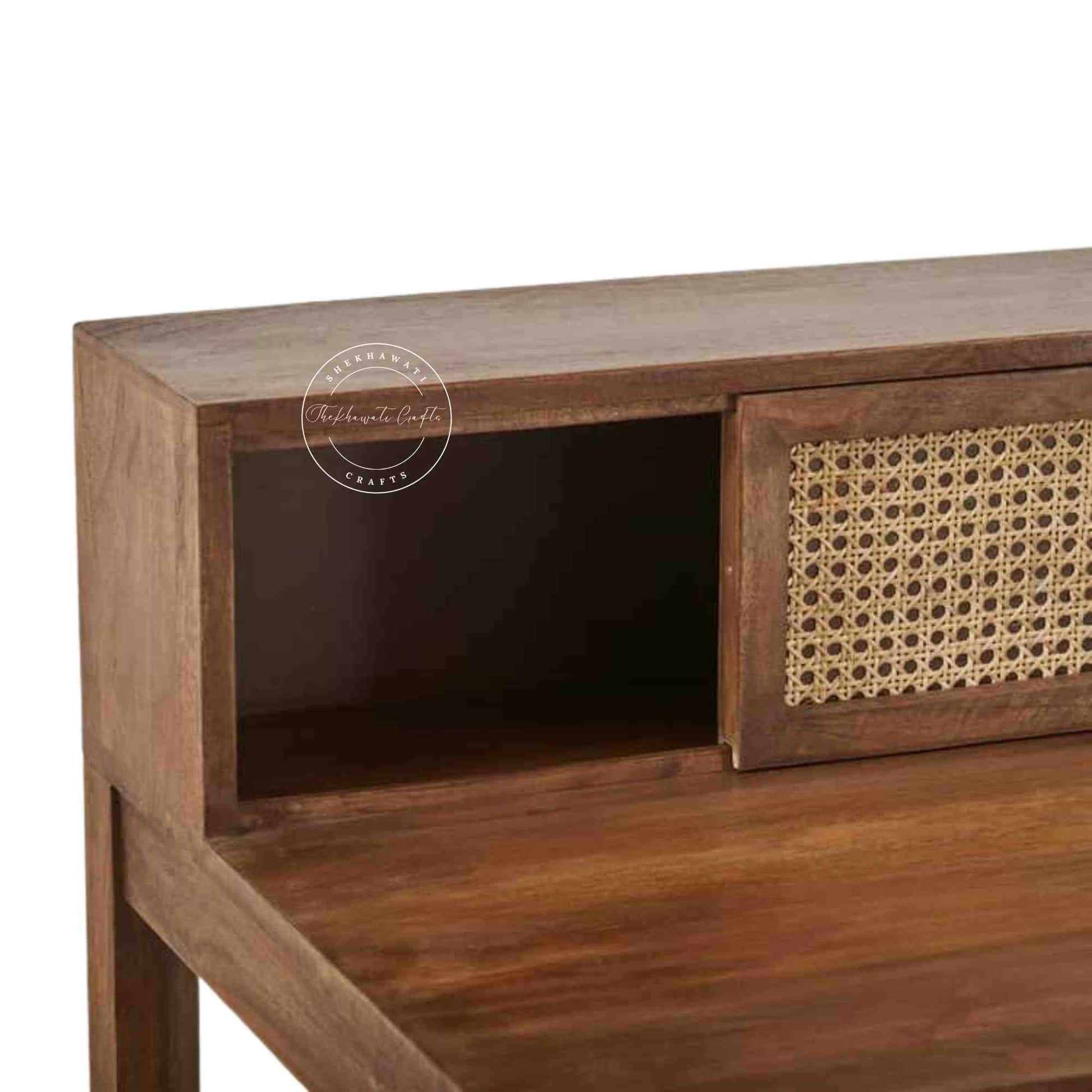 Rattan Study Table handcrafted with mango wood, natural finish, rattan sliding door, and foldable legs.