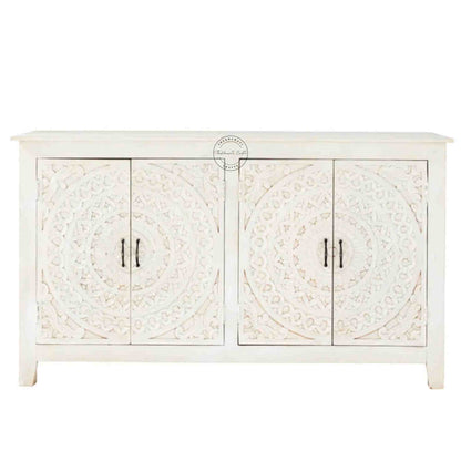 Reyhana handcrafted sideboard made from mango wood features a rustic white finish, with 4 hand-carved doors and foldable shelves.