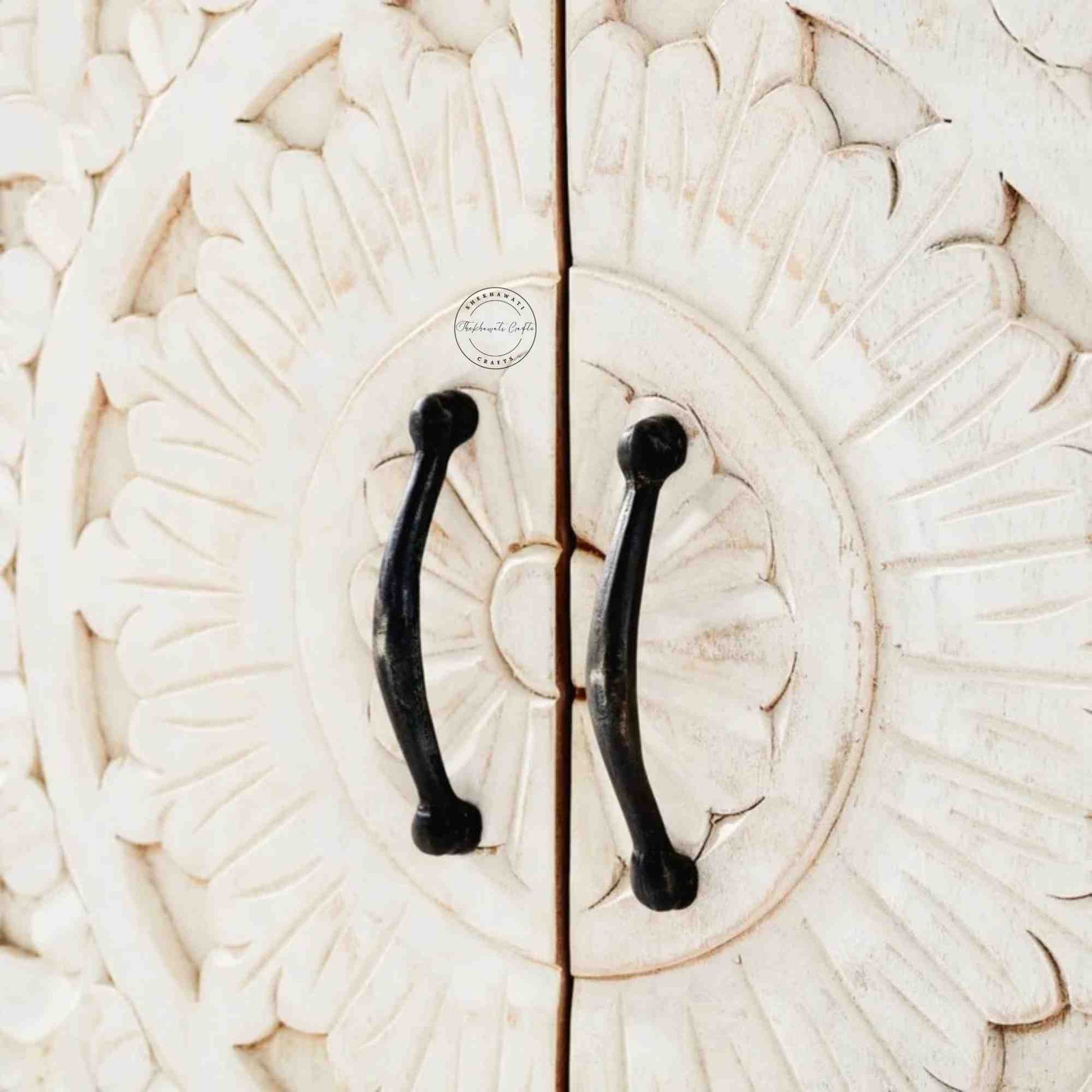 Reyhana handcrafted sideboard made from mango wood features a rustic white finish, with 4 hand-carved doors and foldable shelves.