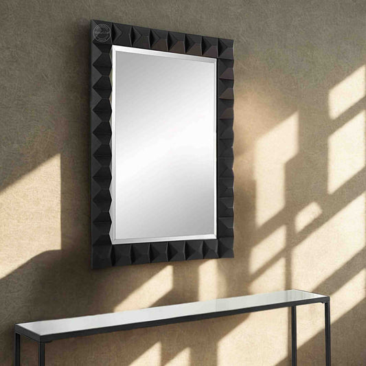 Rocca mirror frame is crafted with mango wood and a matte black finish.