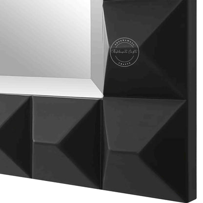 Rocca mirror frame is crafted with mango wood and a matte black finish.