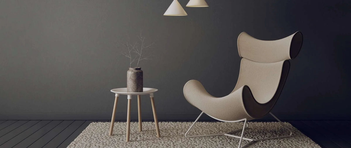 Shekhawati Crafts Banner image showing an armchair and a small side table in a light dark background.