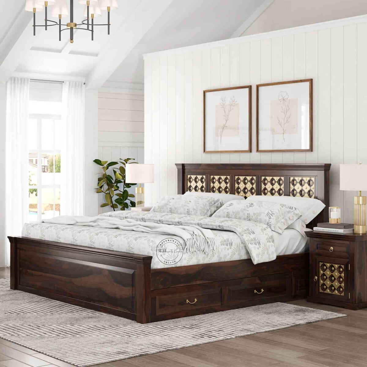 A king size wooden bed with brass inlays and storage drawers, in a room with light walls.