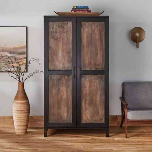 The Pint Bar Cabinet is handcrafted with mango wood and a dual tone finish, 2 doors, bottles and glass sections.