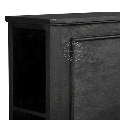 close up view of a wooden king size bed with a dark wooden headboard.