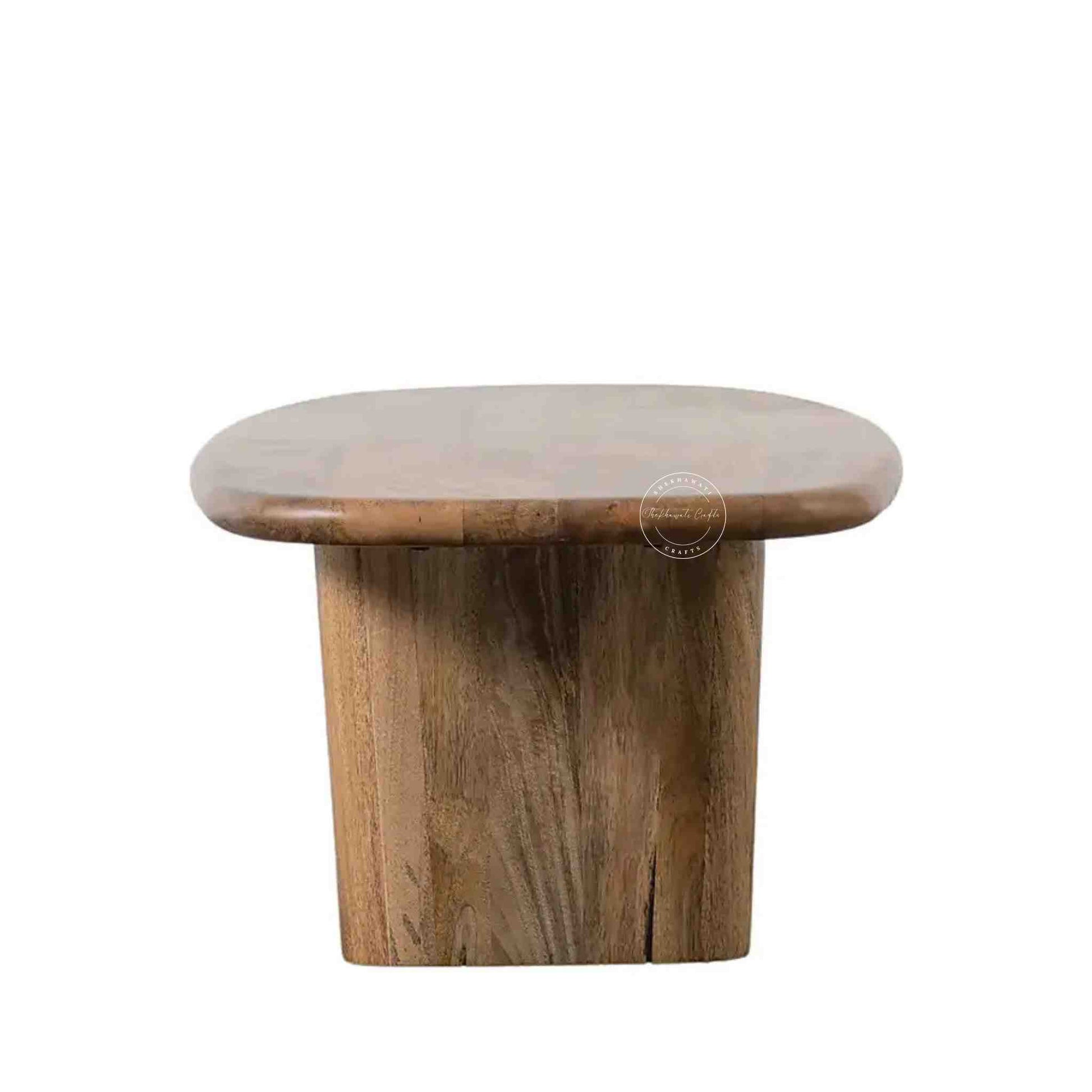 Handcrafted Tiara Mango Wood Coffee Table featuring an oval design and foldable legs.