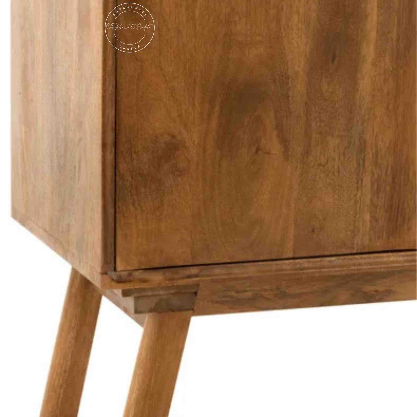 Handcrafted Umber Cabinet made from mango wood with a natural wood finish. It features four doors and detachable shelves.