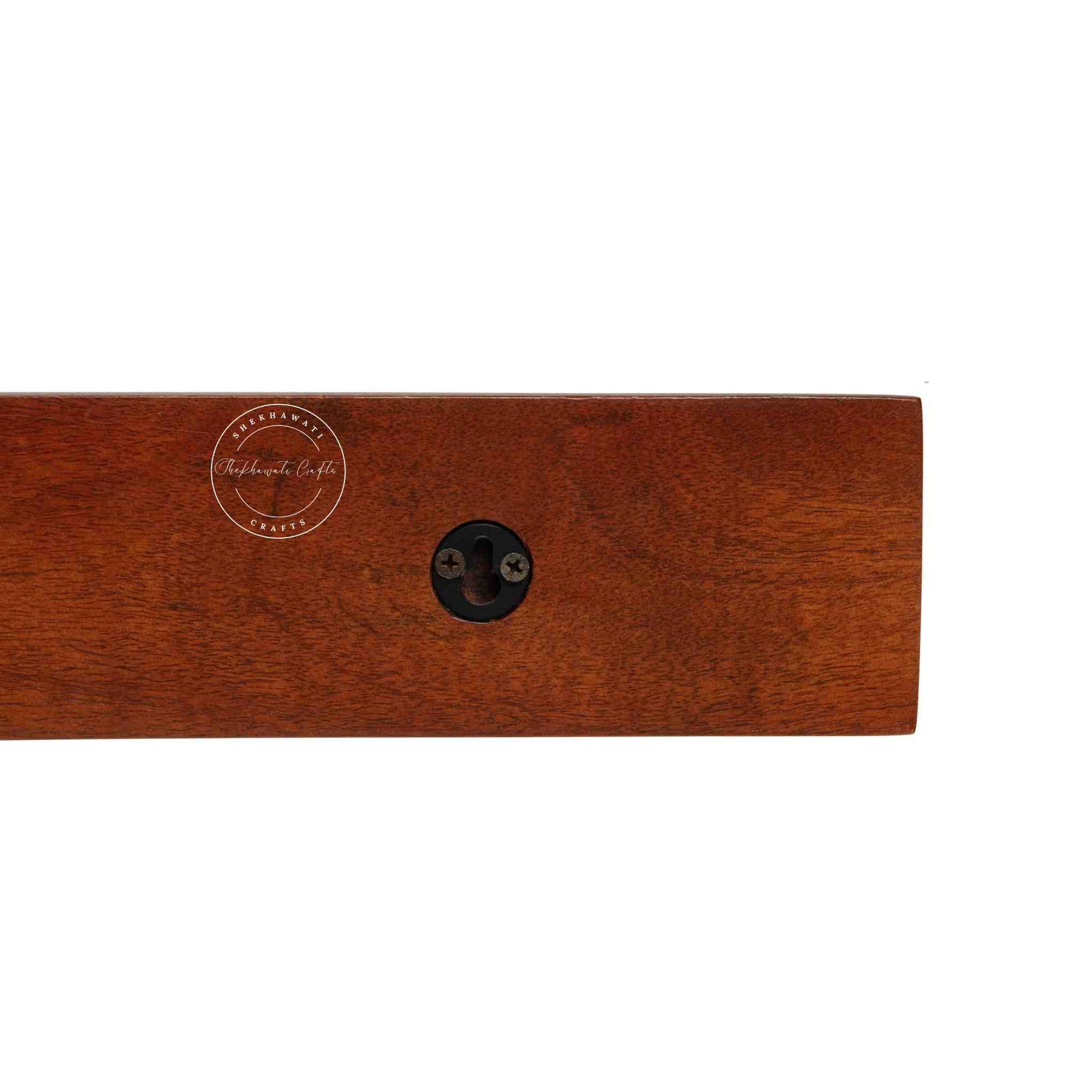 handcrafted Veda mango wood hanging wall shelf in honey finish.