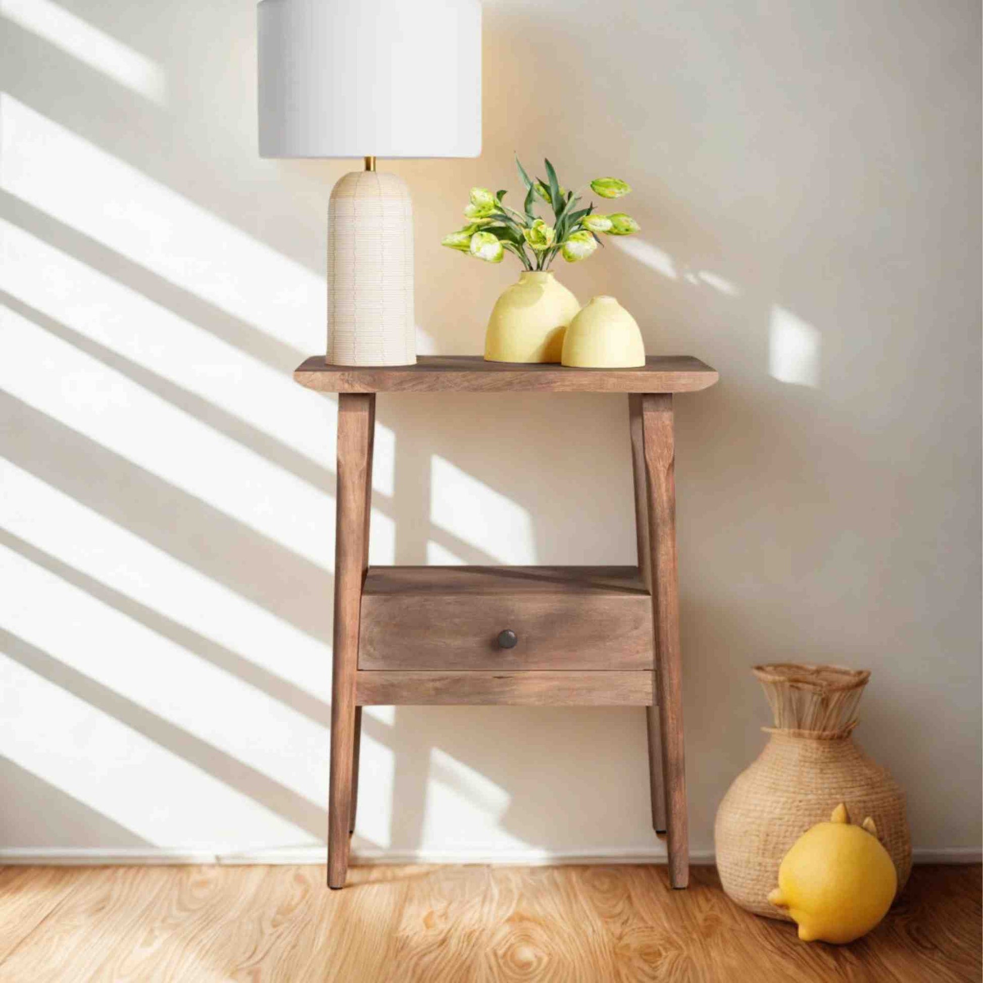 Venus end table is handmade from mango wood with natural finish and 1 drawer for storage
